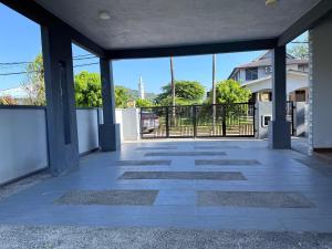 an empty patio with a view of a building at Teratak Chena - Lux Bungalow in Kuala Terengganu