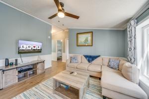 a living room with a couch and a table at Bayside Haven in Deep Hole