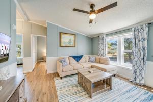 a living room with a couch and a table at Bayside Haven in Deep Hole