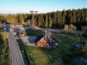 an aerial view of a house and a road at Chalupa Chudobka in Janske Lazne