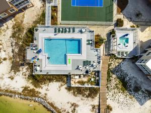 an overhead view of a swimming pool on the beach at Soundside Holiday Beach Resort in Pensacola Beach