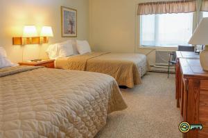 a hotel room with two beds and a window at Aspen East Unit #131 in Basye