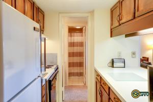 a kitchen with a white counter top and a refrigerator at Aspen East Unit #131 in Basye
