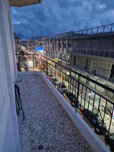 a balcony with a view of a parking lot at Nicolas Luxury Apartment in Amalias