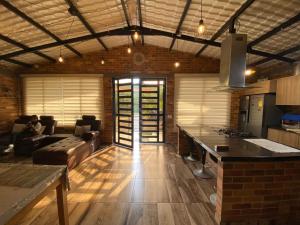 a room with a kitchen and a living room at la samara in Anapoima