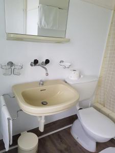 a bathroom with a sink and a toilet at Ambiente in Emmetten in Emmetten