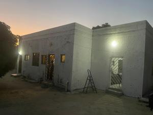a building being constructed with a ladder next to it at Kokoma Apartment in Katima Mulilo in Katima Mulilo