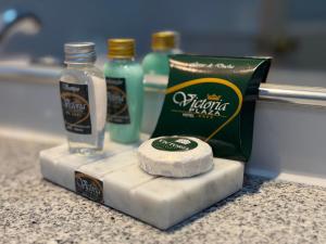 a block of cheese and a bottle of alcohol on a counter at Hotel Victoria Plaza in Tarija