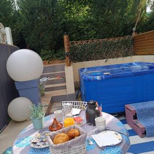 a table with bread and a vase on it at Clos fleury in Cluny