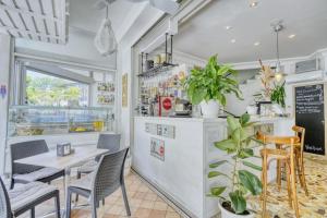 a dining room with a table and chairs at Hotel Everest - Bar e Ristorante in Gabicce Mare
