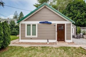 a small house with a sign on top of it at Cozy Bungalow 7 Blocks from ND Campus in South Bend