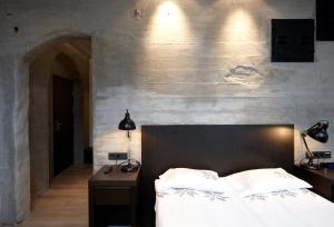 Postel nebo postele na pokoji v ubytování Fosshotel Rauðará