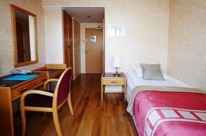 Postel nebo postele na pokoji v ubytování Fosshotel Rauðará