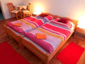 A bed or beds in a room at Penzión Gardoš
