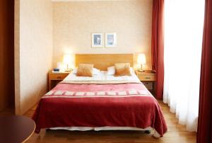 Postel nebo postele na pokoji v ubytování Fosshotel Rauðará