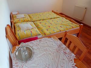 A bed or beds in a room at Penzión Gardoš