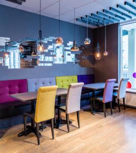 a dining room with a table and chairs at Fosshótel Rauðará in Reykjavík