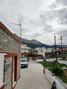 a car parked in a parking lot next to a building at sevas'view in Émbonas