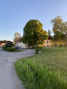 a house with a playground and a field of grass at Ferienwohnung Abendsonne in Schenkenfelden