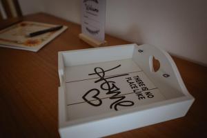 a box with a sign on it sitting on a table at Orli Home e Relax in Casole dʼElsa