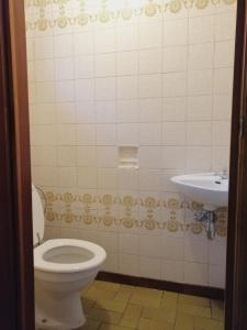 a bathroom with a toilet and a sink at La Doudou Maison à louer in Mons