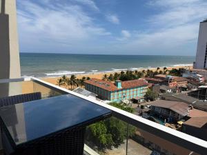 a view of the beach from the balcony of a building at Ocean Breeze Residencies in Negombo