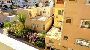 an aerial view of a building with flowers on the side at Solara in Hurghada