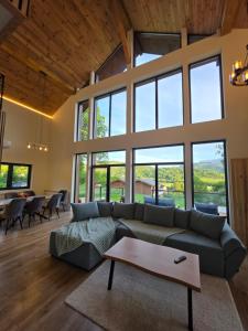 a living room with a couch and a table at CabanaFriendly in Râşnov