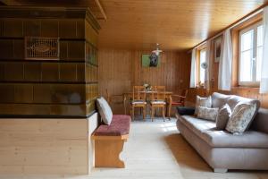 a living room with a couch and a table at Berghaus Antonia in Mellau