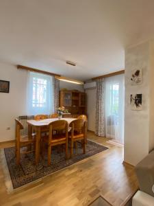 a dining room with a table and chairs at Holiday Home Ilidza Ella in Sarajevo