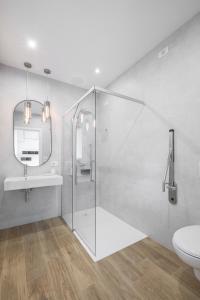 a bathroom with a shower and a sink and a toilet at el Zhìgol B&B in Farra di Soligo +21 photos