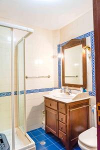 a bathroom with a sink and a shower at Cantinho de Caria in Caria +24 photos