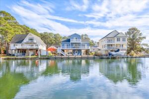 a row of houses next to a large body of water at Coastal Crab in Greenbackville