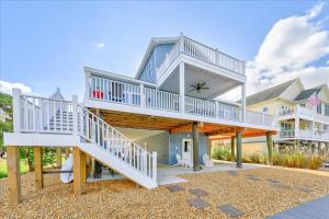 a large house with a staircase in front of it at Coastal Crab in Greenbackville