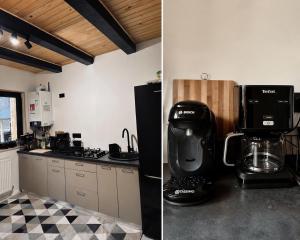 a kitchen with a coffee maker on a counter at The Black Barn in Frumosu