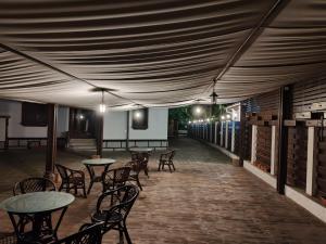 a room with tables and chairs under a tent at Vintage House Apart in Buzău