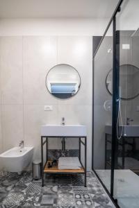 a bathroom with a sink and a mirror at Casa Di Luca in Chioggia