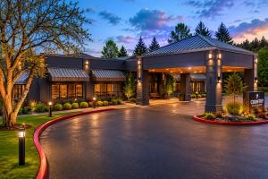 a building with a driveway in front of it at Country Inn & Suites by Radisson, Seattle-Bothell, WA in Bothell