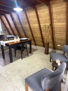 a dining room with a table and chairs at Casa Alpina in Navarro