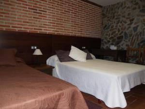 Voodi või voodid majutusasutuse Hotel Rural El Rocal toas