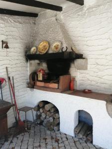 a brick oven with two plates on top of it at Casa D'Afife in Afife