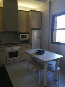a kitchen with a table with a bowl on it at Casa D'Afife in Afife