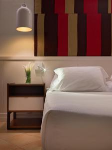 A bed or beds in a room at H10 Playa Esmeralda - Adults Only