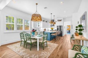 a dining room and kitchen with a table and chairs at The Luxe Sunshine Villa w Private Pool House in West Palm Beach +38 photos