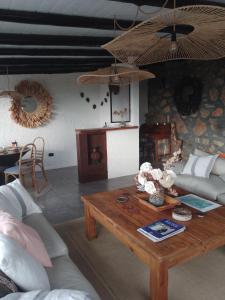 a living room with a couch and a coffee table at Oveja Mansa in La Cumbre