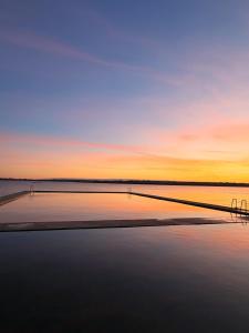 a sunset over a body of water at Entire home in Belmullet in Belmullet