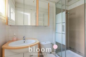 a bathroom with a sink and a shower at La maison de C Moench in Nancy