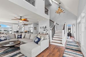 a living room with a couch and a table at Gallops Point in Greenbackville