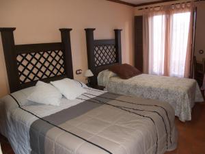 Voodi või voodid majutusasutuse Hotel Rural El Rocal toas