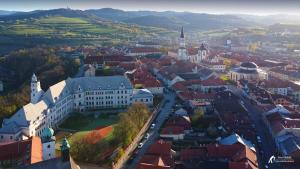 an aerial view of a city with buildings and roads at genius loci apartments in Levoča